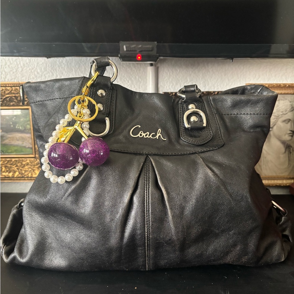 Coach Ashley Black Leather Handbag with Purple Charm Accents and Satin Lining